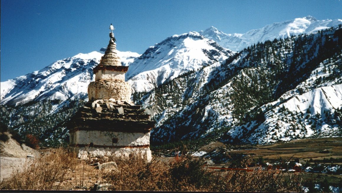 Chorten ( Buddhist shrine ) and the Annapurna Himal from Manang Valley