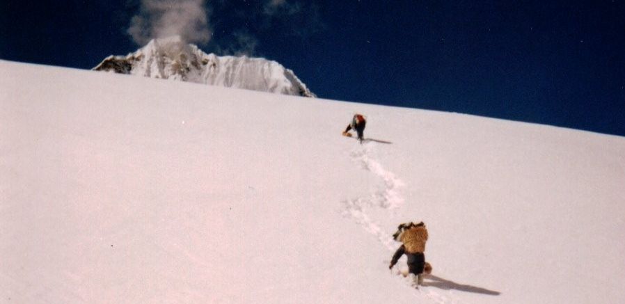Top of Mt.Ganshempo on climbing final snow slopes to Tilman's Pass