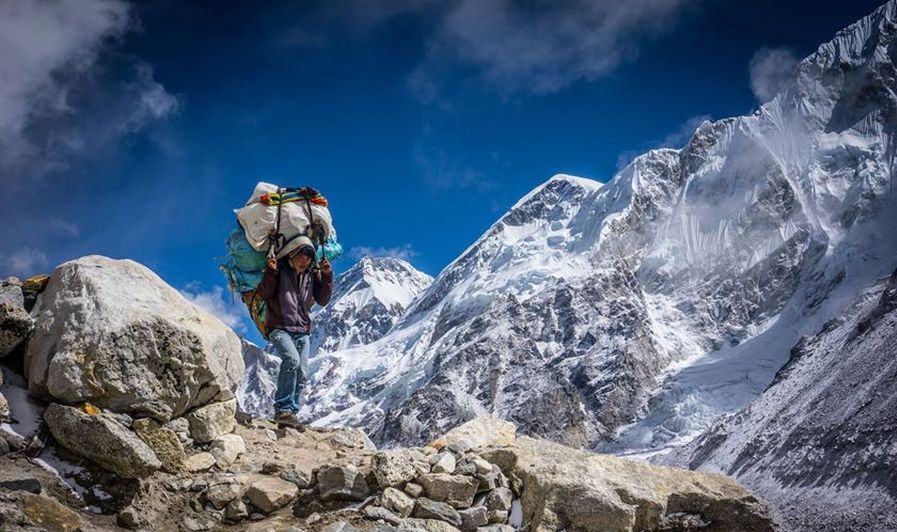 Nepalese Trekking Porter on route from Lobuje to Kallar Pattar