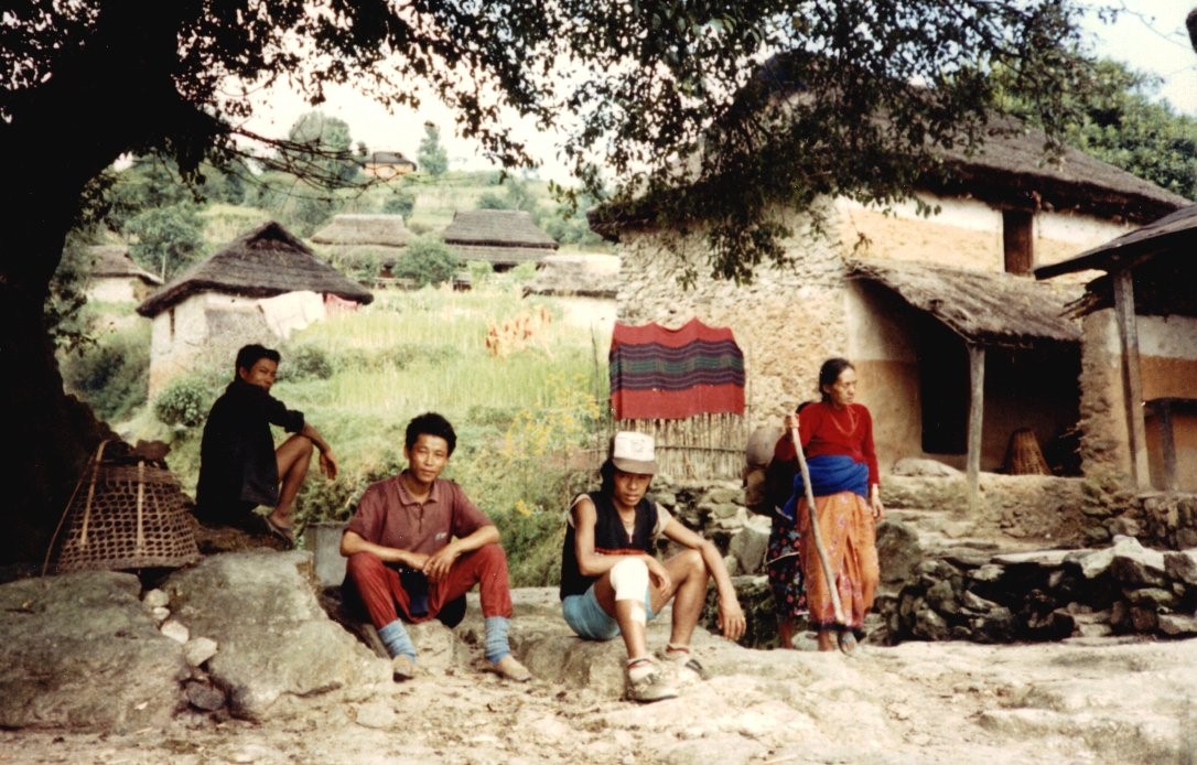 Nepalese Trekking Crew at a Rest stop at village on descent to Sundarijalon the outskirts of Kathmandu