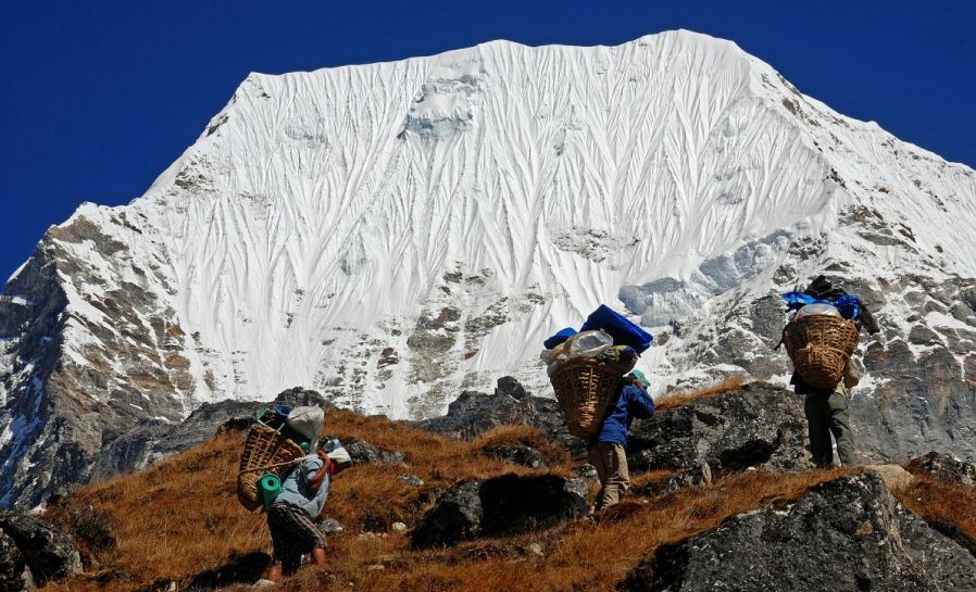 Sherpa Porters in Rolwaling Valley beneath Mount Chobutse