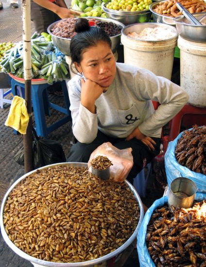 Cambodian Woman Trader at stall in Phsar Thom Thmei market in Phnom Penh