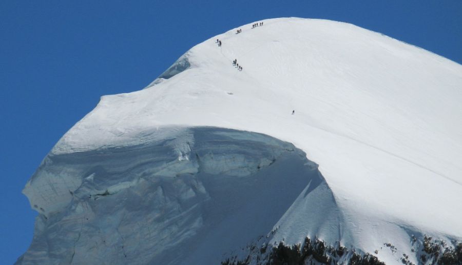 Climbers on the SSW Flank ( normal ascent route - Alpine grade F ) of the Breithorn above Zermatt in the Swiss Alps