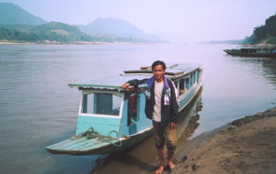 Cruise Boat and captain on Mekong River at Luang Prabang