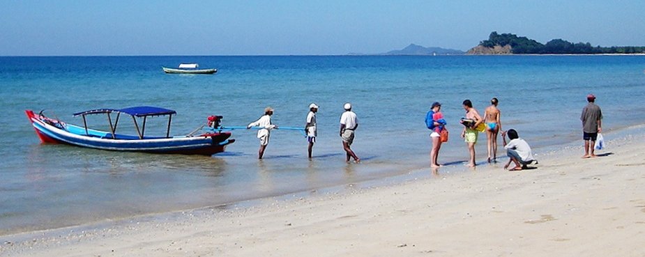 Pleasure Boat and Tourists on Ngapali Beach