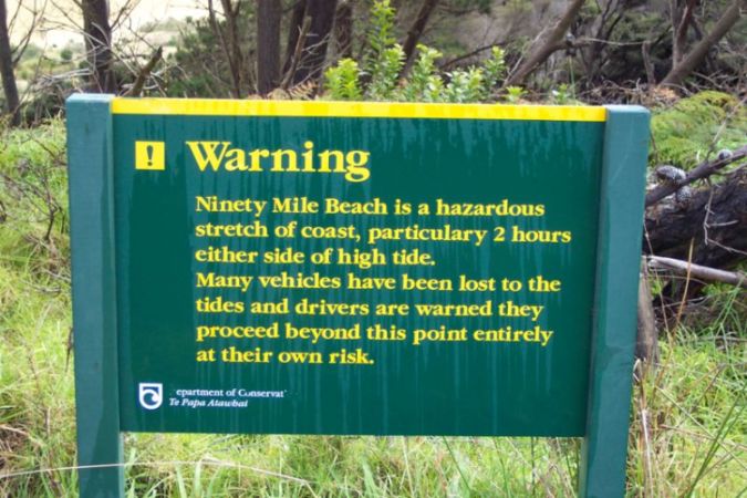 Warning Sign on 90 Mile Beach in North Island of New Zealand