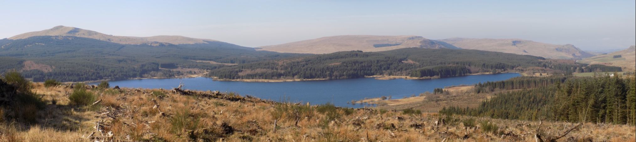 Panoramic view on ascent of Cairnoch Hill: Meikle Bin above Carron Valley Reservoir, Campsie Fells and Fintry Hills above Carron Valley