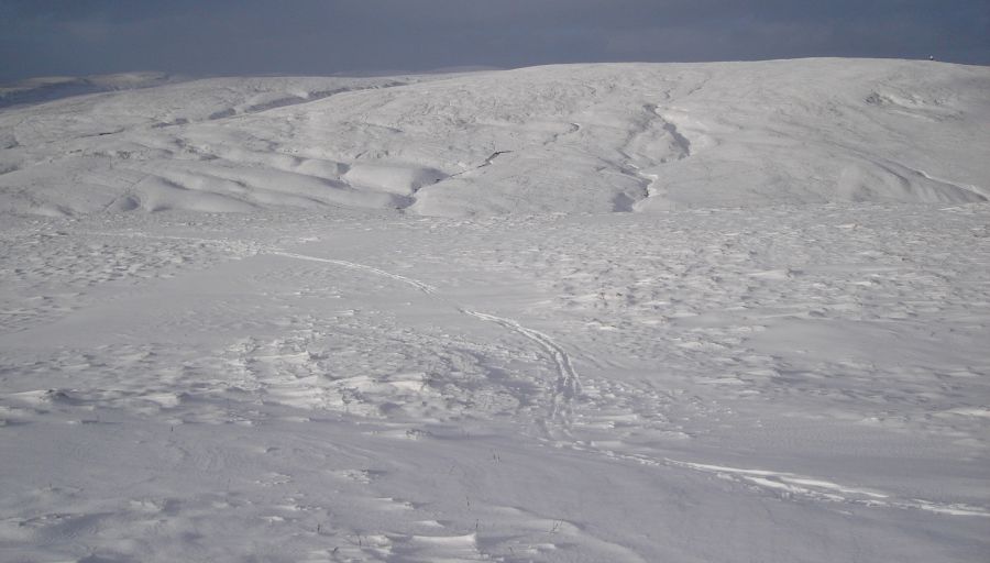 Ski ascent of the snow-covered Campsie Fells in winter
