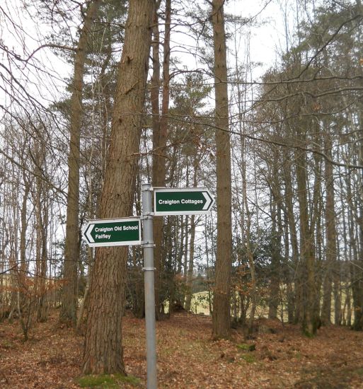 Signpost in woods at Craigton