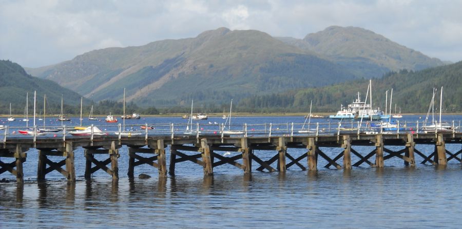 The pier and marina at Sandbank with Beinn Bheula in the background