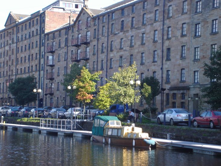 Former grain mills and stores converted to flats at Speirs Wharf, Port Dundas on the Forth and Clyde Canal in central Glasgow