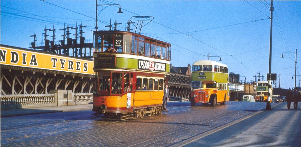 Tram and corporation buses on the George V Bridge over the River Clyde in Glasgow