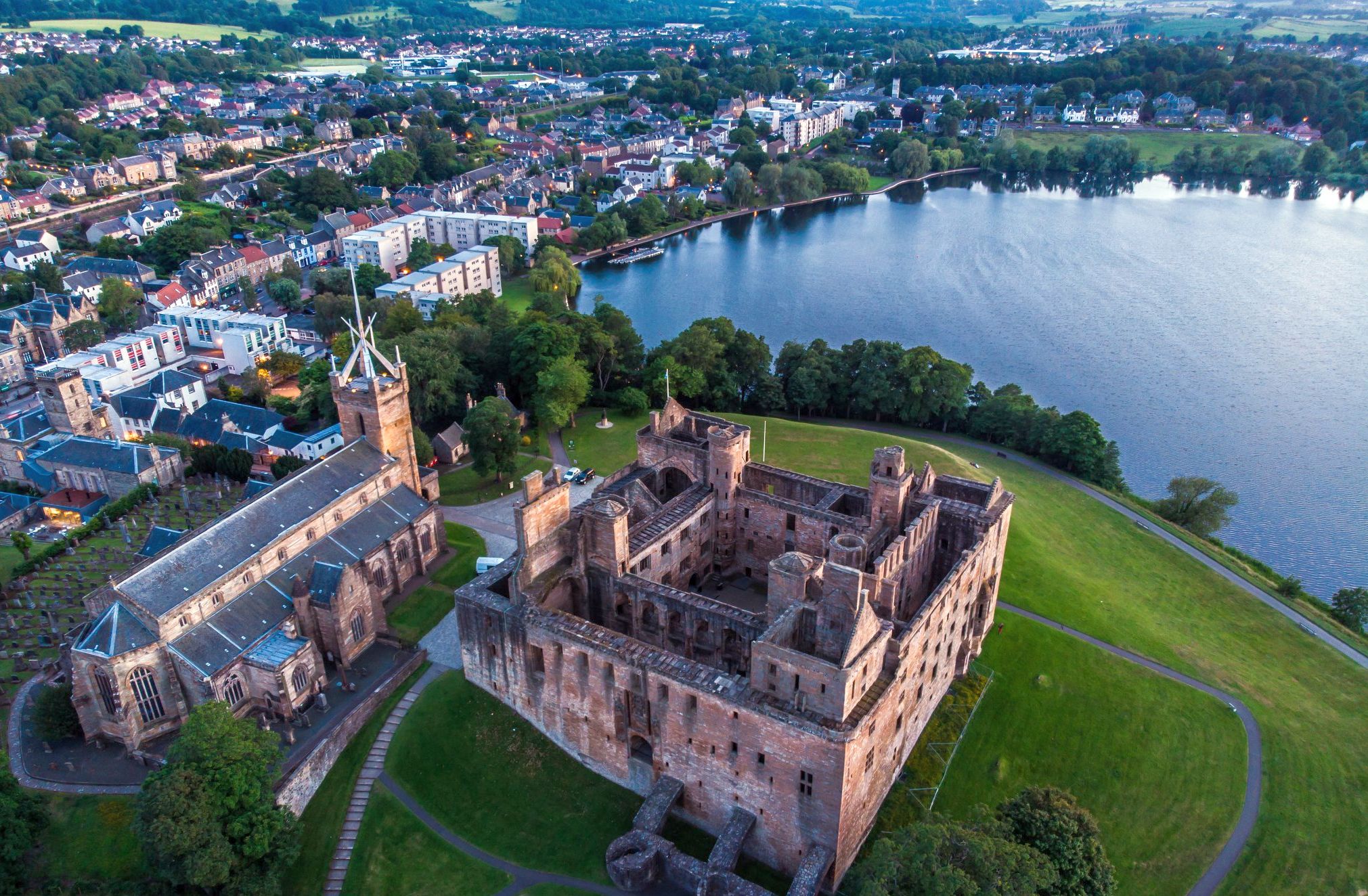 Aerial view of Linlithgow Palace and St Michael's Church and the Loch