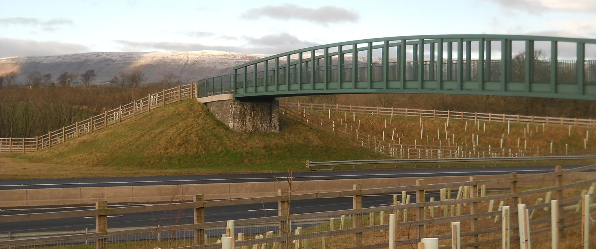 Campsie Fells and the Burnbrae Bridge carrying the Strathkelvin Railway Path over the link road to Kirkintilloch