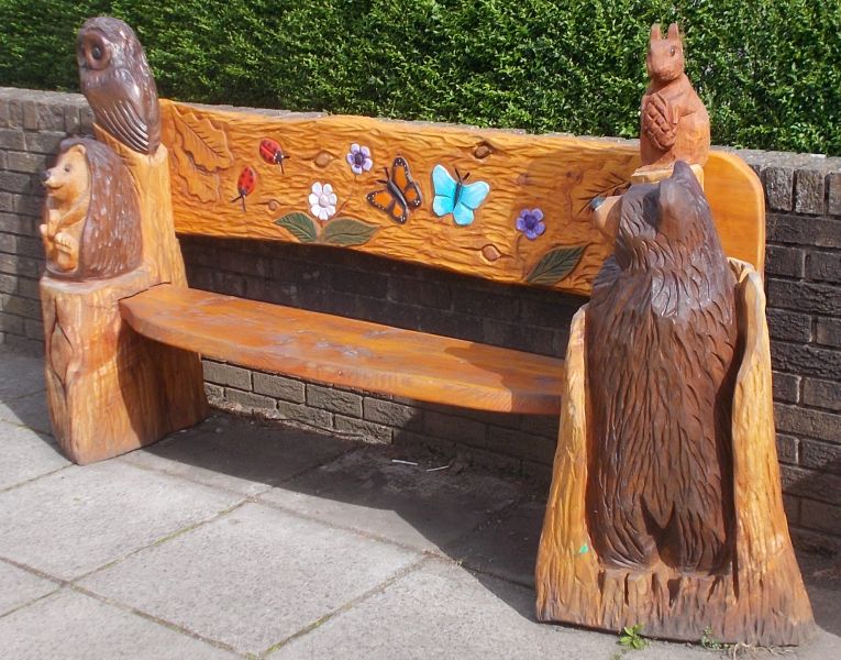 Carved Wooden Bench at Village Hall in Westerton