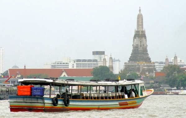 River Taxi on Chao Phraya River approaching Wat Arun in Bangkok