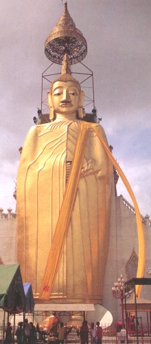 Standing Buddha at Wat Intharawihan in Bangkok
