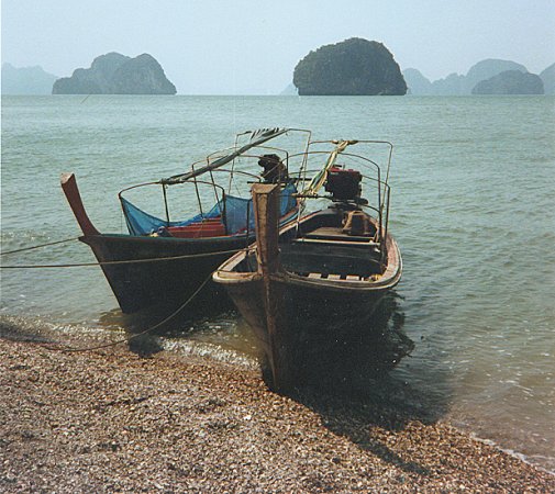 Tour Boats on the beach in Phang Nga Bay in Southern Thailand