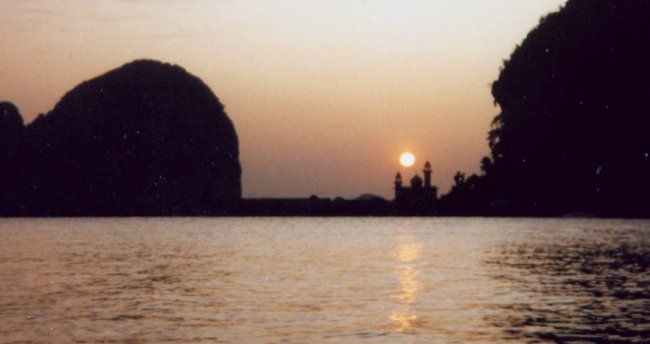 Sunset over Mosque on Ko Panyi in Phang Nga Bay in Southern Thailand