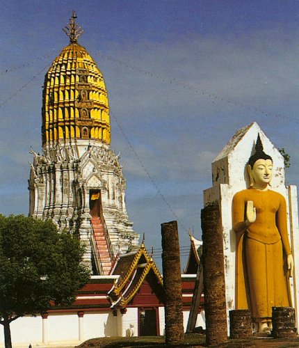 Standing Buddha and Stupa Wat Phra Si Rattana Mahathat ( Wat Yai ) in Phitsanulok in Northern Thailand