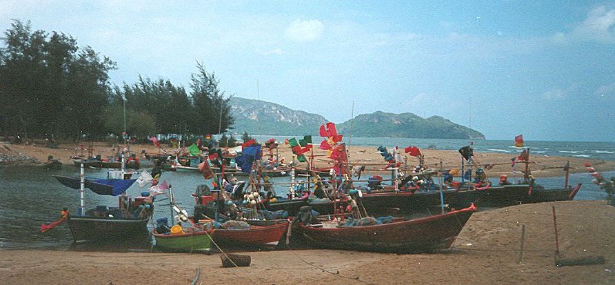 Boats of Fishing Fleet in sheltered bay at Prachuap Kiri Khan in Southern Thailand