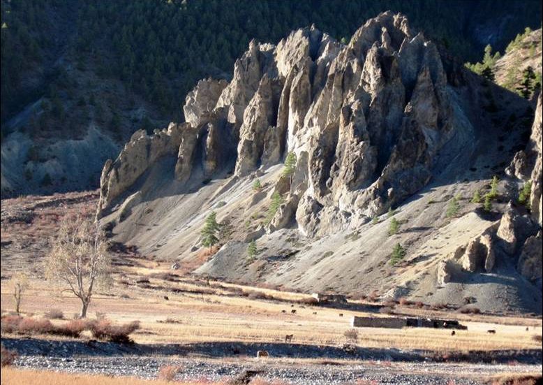 Wierdly eroded rock formations in Manang Valley on the approach to Manang Village