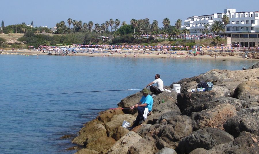 The beach at Coral Bay from the breakwater at the marina