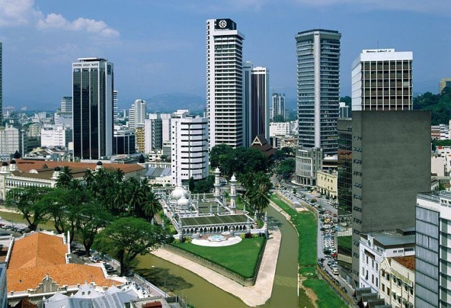 High-rise buildings surrounding Masjid Jame ( The Friday Mosque ) in Kuala Lumpur