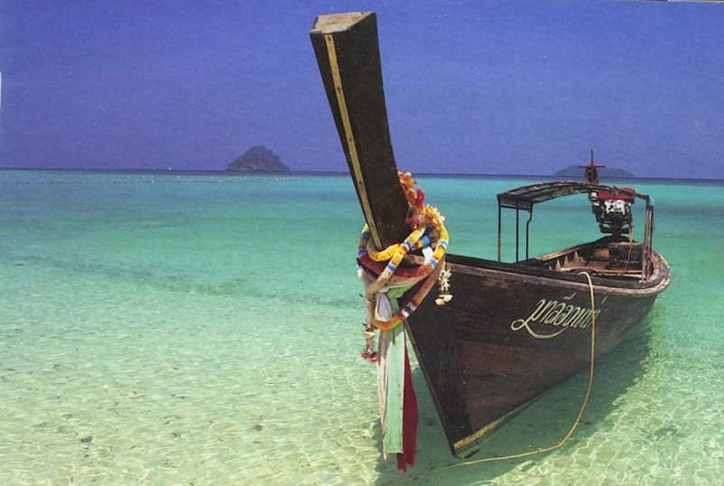 Tour Boat on the beach in Phang Nga Bay in Southern Thailand